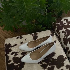White leather pumps